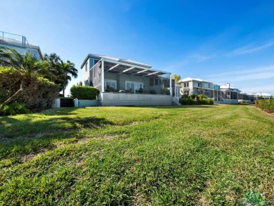 Discover the essence of waterfront elegance in this meticulously on Longboat Key Golf Club in Florida - for sale on GolfHomes.com, golf home, golf lot