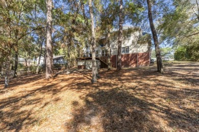 Thoughtfully designed, this 5-bedroom home provides exceptional on Rocky Bayou Country Club in Florida - for sale on GolfHomes.com, golf home, golf lot