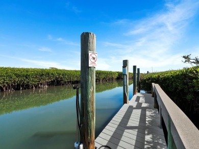 Discover the essence of waterfront elegance in this meticulously on Longboat Key Golf Club in Florida - for sale on GolfHomes.com, golf home, golf lot