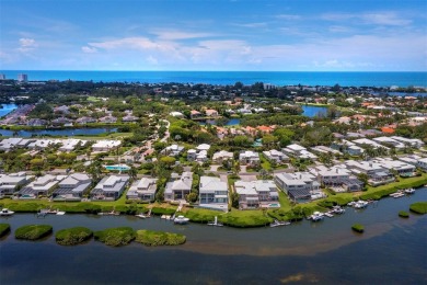 Discover the essence of waterfront elegance in this meticulously on Longboat Key Golf Club in Florida - for sale on GolfHomes.com, golf home, golf lot