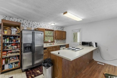 Discover the potential of this 3-bedroom, 2-bath home perfectly on Sea Trail Golf Resort in North Carolina - for sale on GolfHomes.com, golf home, golf lot