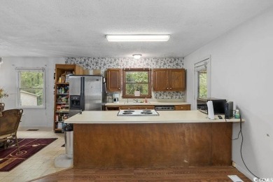 Discover the potential of this 3-bedroom, 2-bath home perfectly on Sea Trail Golf Resort in North Carolina - for sale on GolfHomes.com, golf home, golf lot