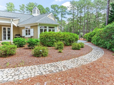 Overlooking the 7th green of Pinewild's Magnolia Course, this on Pinewild Country Club of Pinehurst in North Carolina - for sale on GolfHomes.com, golf home, golf lot