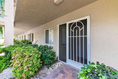 Welcome to beautiful Coral Cove to this spacious ground floor on Westchester Golf and Country Club in Florida - for sale on GolfHomes.com, golf home, golf lot