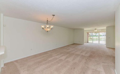 Welcome to beautiful Coral Cove to this spacious ground floor on Westchester Golf and Country Club in Florida - for sale on GolfHomes.com, golf home, golf lot