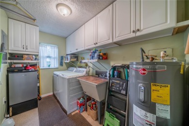 This is an exceptional condo! You need to see this one to on Falcon Watch Golf Club in Florida - for sale on GolfHomes.com, golf home, golf lot