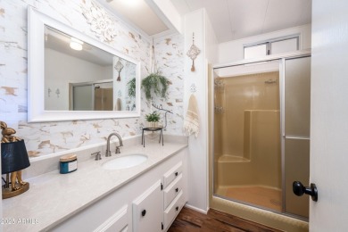 This charming and well-maintained, recently updated 2-bedroom on Fountain of the Sun Country Club in Arizona - for sale on GolfHomes.com, golf home, golf lot