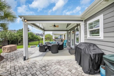 Discover this stunning 1.5-story craftsman-style home on Surf Golf and Beach Club in South Carolina - for sale on GolfHomes.com, golf home, golf lot