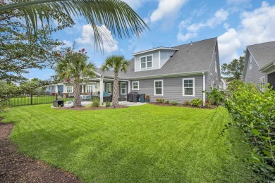 Discover this stunning 1.5-story craftsman-style home on Surf Golf and Beach Club in South Carolina - for sale on GolfHomes.com, golf home, golf lot