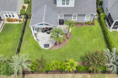 Discover this stunning 1.5-story craftsman-style home on Surf Golf and Beach Club in South Carolina - for sale on GolfHomes.com, golf home, golf lot
