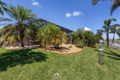 Priced to SELL this TROPICAL canal front beauty that exudes rest on Rotonda Golf and Country Club - Long Marsh  in Florida - for sale on GolfHomes.com, golf home, golf lot