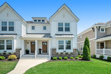 Discover unparalleled elegance in this luxurious townhome within on The Macatwa Legends Golf Course in Michigan - for sale on GolfHomes.com, golf home, golf lot