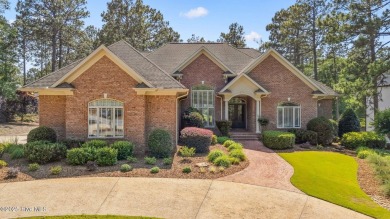 This stately all-brick home overlooking the 6th green of on The National Golf Club in North Carolina - for sale on GolfHomes.com, golf home, golf lot