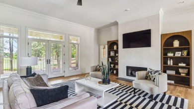 This stately all-brick home overlooking the 6th green of on The National Golf Club in North Carolina - for sale on GolfHomes.com, golf home, golf lot
