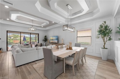 This highly desirable Maria model showcases a wide eastern lake on Bonita National Golf Course in Florida - for sale on GolfHomes.com, golf home, golf lot