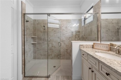 This highly desirable Maria model showcases a wide eastern lake on Bonita National Golf Course in Florida - for sale on GolfHomes.com, golf home, golf lot