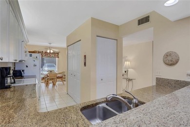 This desirable first floor condo has stunning lake views from on Riviera Golf Club in Florida - for sale on GolfHomes.com, golf home, golf lot