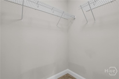 Welcome to this well-maintained townhome in the gated community on Savannah Quarters Country Club in Georgia - for sale on GolfHomes.com, golf home, golf lot