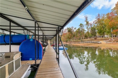 Lakefront condo with a deeded boat slip and boat for under on Stone Creek Cove Golf Course in South Carolina - for sale on GolfHomes.com, golf home, golf lot