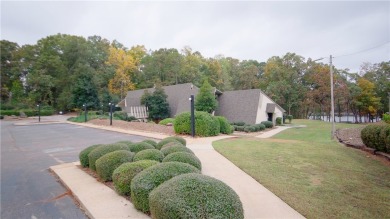 Lakefront condo with a deeded boat slip and boat for under on Stone Creek Cove Golf Course in South Carolina - for sale on GolfHomes.com, golf home, golf lot