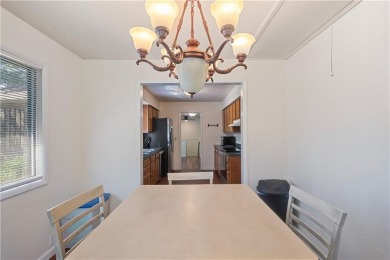 Spacious 4-bedroom, 2-bath home on 1.2 acres overlooking the on Independence Country Club in Kansas - for sale on GolfHomes.com, golf home, golf lot