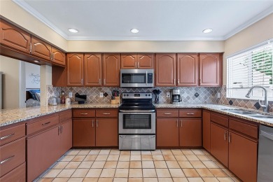 Welcome to this beautifully maintained 3-bedroom, 2-bath home on The Grand Club - Pine Lakes Course in Florida - for sale on GolfHomes.com, golf home, golf lot