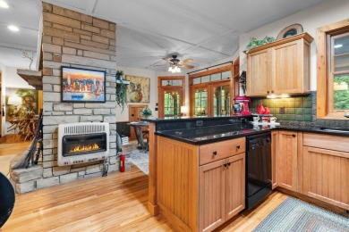 This charming bungalow is nestled in the woods within the quiet on Trillium Links in North Carolina - for sale on GolfHomes.com, golf home, golf lot