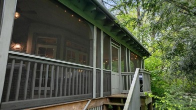 This charming bungalow is nestled in the woods within the quiet on Trillium Links in North Carolina - for sale on GolfHomes.com, golf home, golf lot