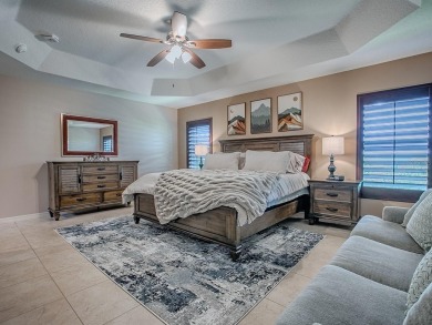 Surrounded by lush, mature landscaping, this beautiful Aspen- on The Links of Spruce Creek in Florida - for sale on GolfHomes.com, golf home, golf lot