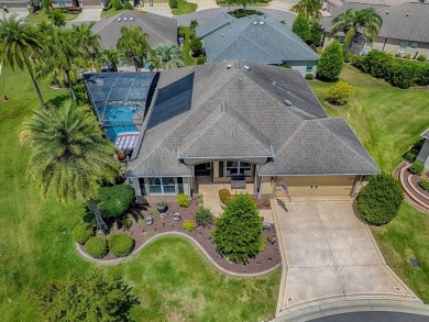 Surrounded by lush, mature landscaping, this beautiful Aspen- on The Links of Spruce Creek in Florida - for sale on GolfHomes.com, golf home, golf lot