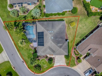 Surrounded by lush, mature landscaping, this beautiful Aspen- on The Links of Spruce Creek in Florida - for sale on GolfHomes.com, golf home, golf lot