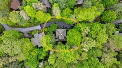 This charming bungalow is nestled in the woods within the quiet on Trillium Links in North Carolina - for sale on GolfHomes.com, golf home, golf lot
