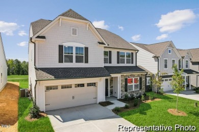 This semi-custom home in Lake Royale offers 3BR/2.5BA and a on River Golf and County Club at Lake Royale in North Carolina - for sale on GolfHomes.com, golf home, golf lot