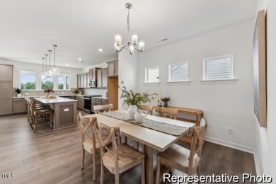 This semi-custom home in Lake Royale offers 3BR/2.5BA and a on River Golf and County Club at Lake Royale in North Carolina - for sale on GolfHomes.com, golf home, golf lot