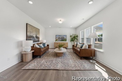 This semi-custom home in Lake Royale offers 3BR/2.5BA and a on River Golf and County Club at Lake Royale in North Carolina - for sale on GolfHomes.com, golf home, golf lot