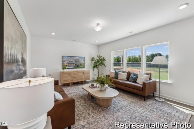 This semi-custom home in Lake Royale offers 3BR/2.5BA and a on River Golf and County Club at Lake Royale in North Carolina - for sale on GolfHomes.com, golf home, golf lot