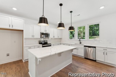 This semi-custom home in the gated, resort-style Lake Royale on River Golf and County Club at Lake Royale in North Carolina - for sale on GolfHomes.com, golf home, golf lot