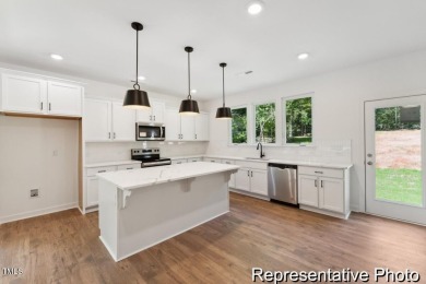 This semi-custom home in the gated, resort-style Lake Royale on River Golf and County Club at Lake Royale in North Carolina - for sale on GolfHomes.com, golf home, golf lot
