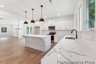 This semi-custom home in the gated, resort-style Lake Royale on River Golf and County Club at Lake Royale in North Carolina - for sale on GolfHomes.com, golf home, golf lot