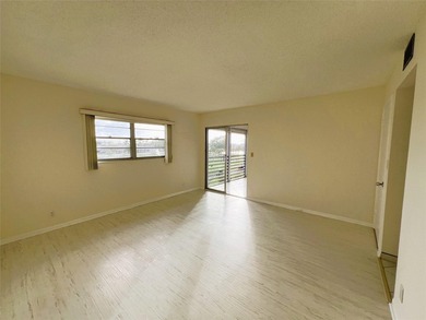 PENTHOUSE with Spectacular GOLF/WATER/FOUNTAIN/CLUBHOUSE VIEW on Wynmoor Golf Course in Florida - for sale on GolfHomes.com, golf home, golf lot