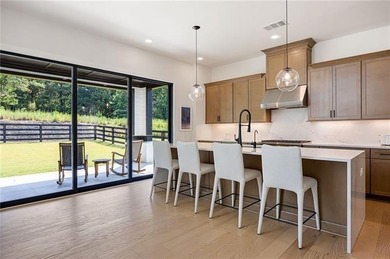 Welcome home to this executive home built by the Toll Brothers on Capital City Club Crabapple in Georgia - for sale on GolfHomes.com, golf home, golf lot