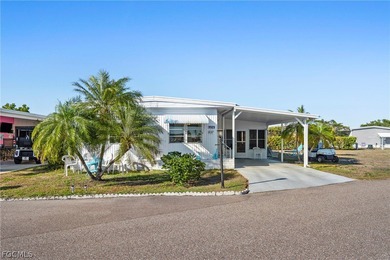 Fully furnished manufactured home in a 55+ waterfront gulf on Riverbend Golf and Country Club in Florida - for sale on GolfHomes.com, golf home, golf lot