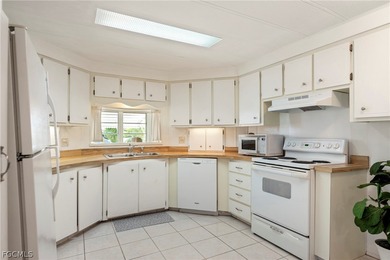 Fully furnished manufactured home in a 55+ waterfront gulf on Riverbend Golf and Country Club in Florida - for sale on GolfHomes.com, golf home, golf lot