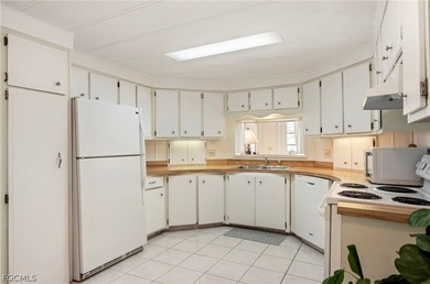 Fully furnished manufactured home in a 55+ waterfront gulf on Riverbend Golf and Country Club in Florida - for sale on GolfHomes.com, golf home, golf lot