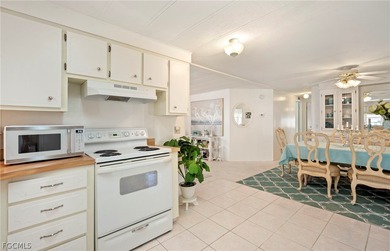 Fully furnished manufactured home in a 55+ waterfront gulf on Riverbend Golf and Country Club in Florida - for sale on GolfHomes.com, golf home, golf lot