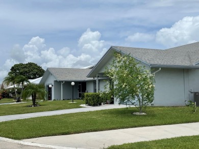 Beautiful updated Bermuda model villa  2 bedroom + den area on Cypress Lakes Golf Course - West Palm Beach in Florida - for sale on GolfHomes.com, golf home, golf lot