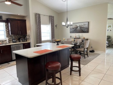 Beautiful updated Bermuda model villa  2 bedroom + den area on Cypress Lakes Golf Course - West Palm Beach in Florida - for sale on GolfHomes.com, golf home, golf lot