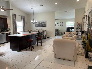 Beautiful updated Bermuda model villa  2 bedroom + den area on Cypress Lakes Golf Course - West Palm Beach in Florida - for sale on GolfHomes.com, golf home, golf lot