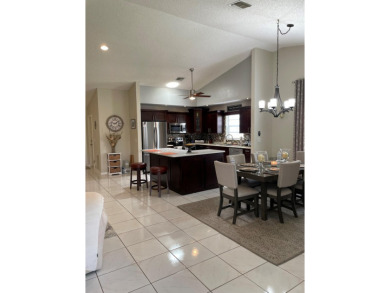 Beautiful updated Bermuda model villa  2 bedroom + den area on Cypress Lakes Golf Course - West Palm Beach in Florida - for sale on GolfHomes.com, golf home, golf lot