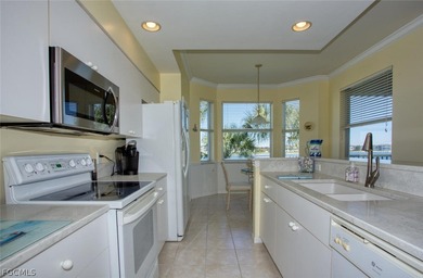Peaceful water views abound in this third-floor condo on Heritage Palms Golf and Country Club in Florida - for sale on GolfHomes.com, golf home, golf lot